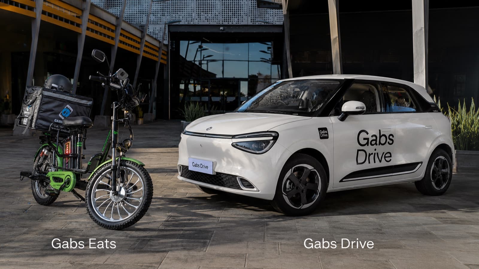 The Gabs Tech electric fleet — a Gabs Eats delivery e-bike beside a Gabs Drive electric car